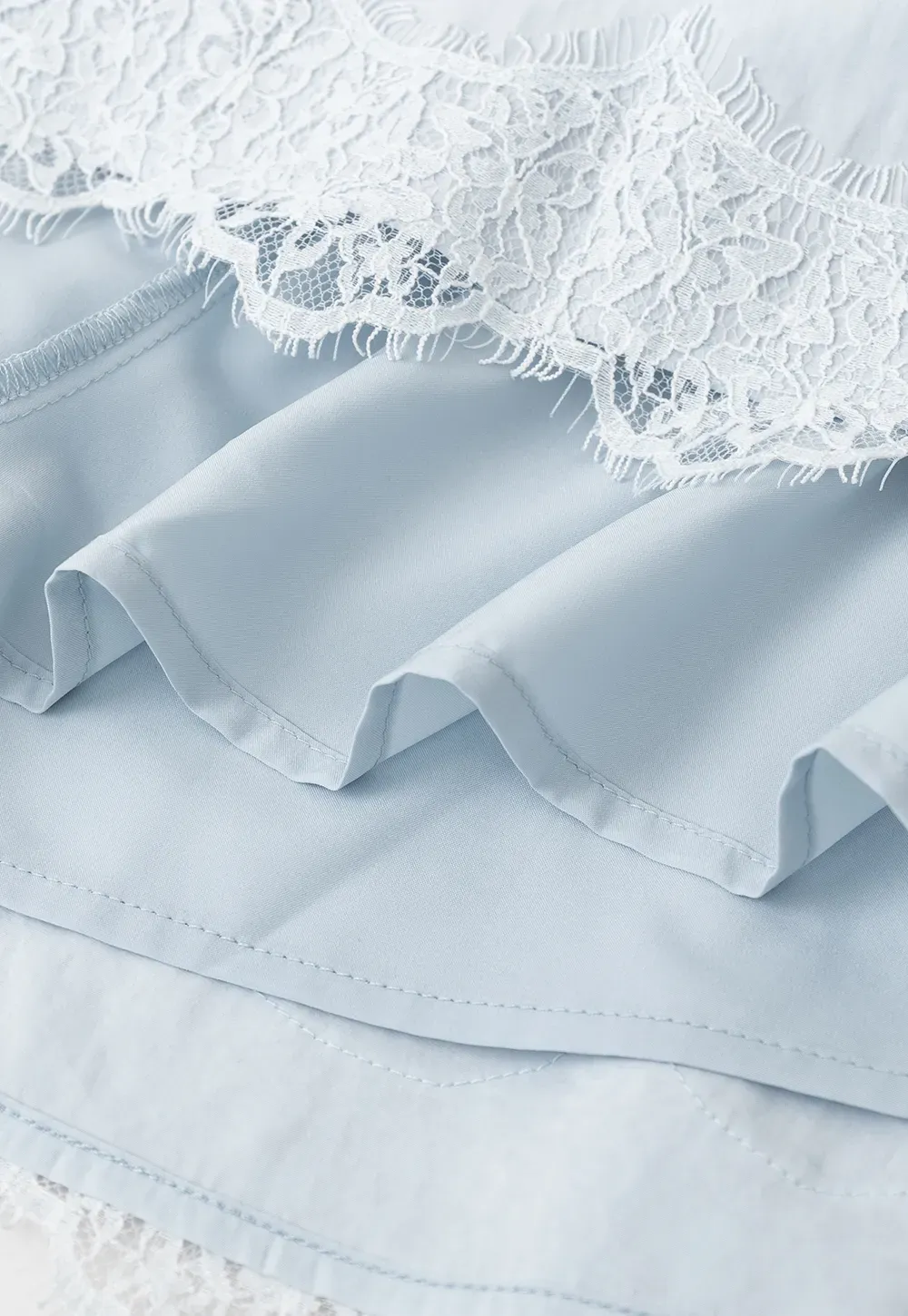 Collarless halter top with lace hem skirt