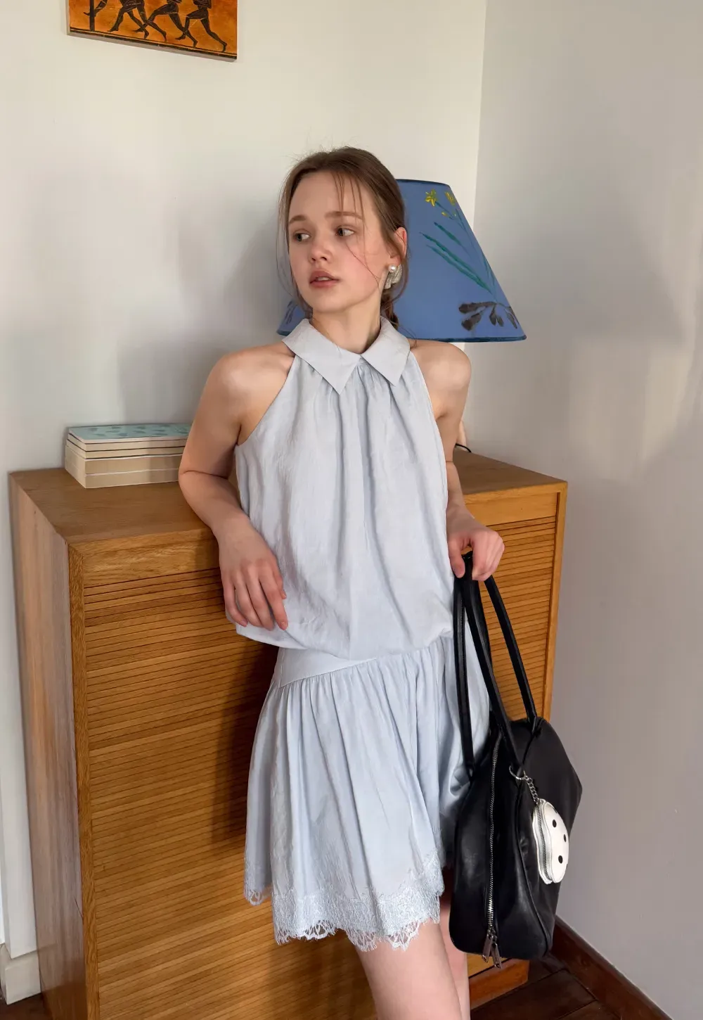 Collarless halter top with lace hem skirt