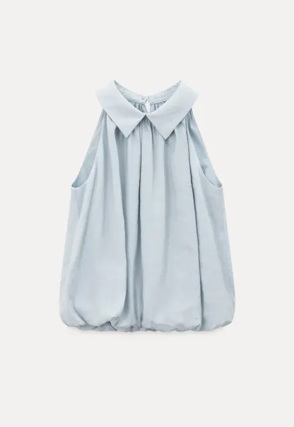 Collarless halter top with lace hem skirt