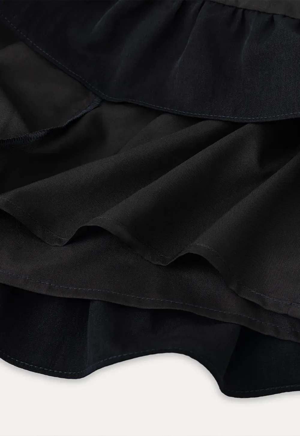 Sleeveless top with bow detail and pleated skirt