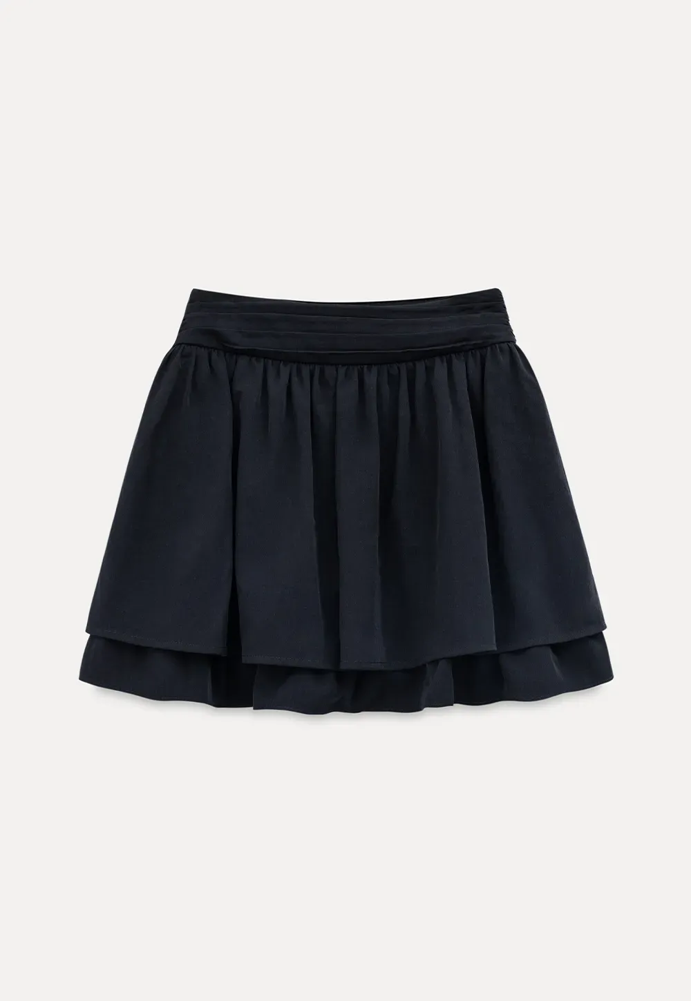 Sleeveless top with bow detail and pleated skirt