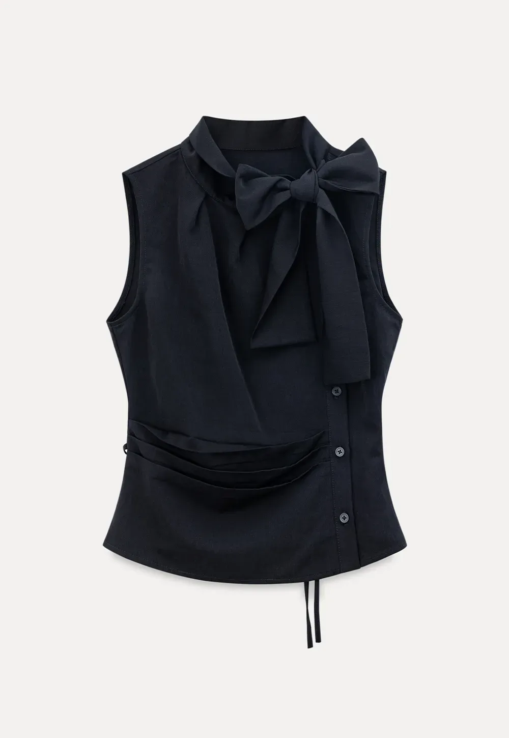 Sleeveless top with bow detail and pleated skirt