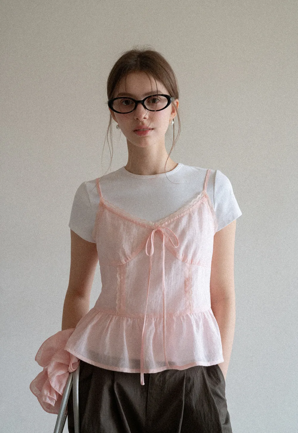 Sheer lace trim camisole with front tie and peplum hem