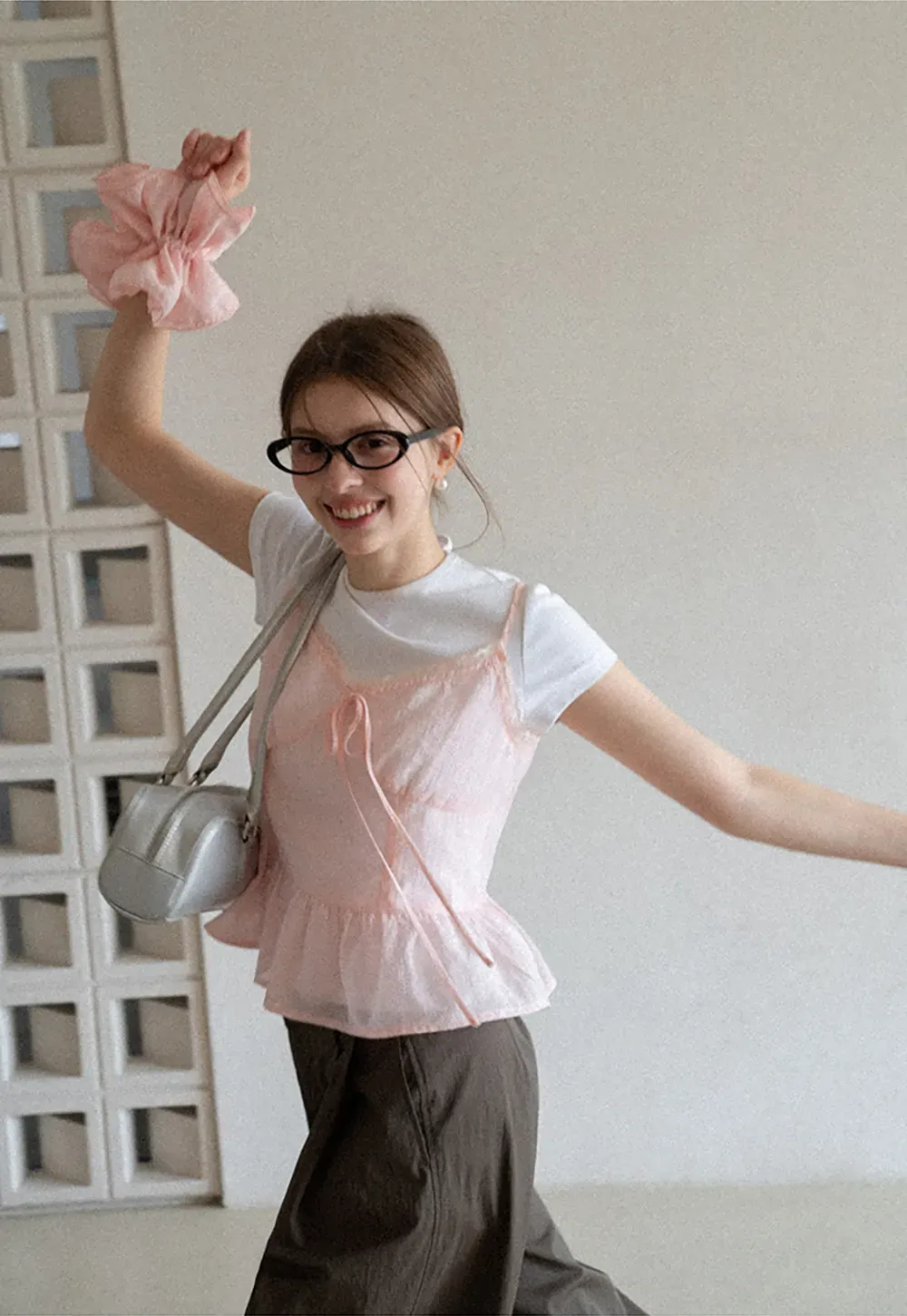 Sheer lace trim camisole with front tie and peplum hem