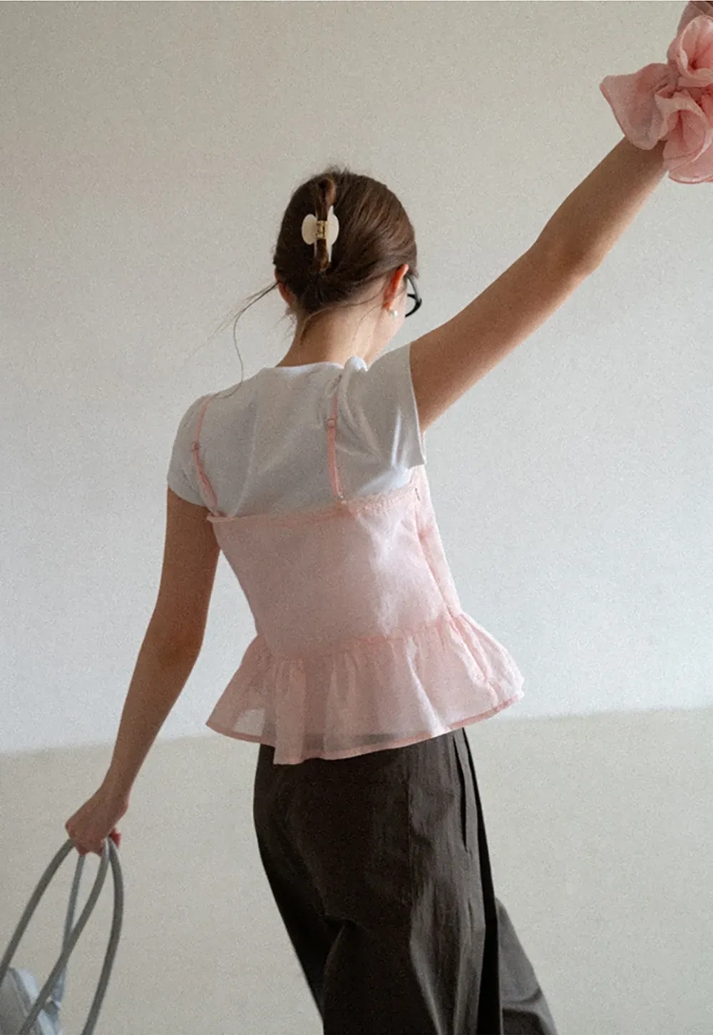 Sheer lace trim camisole with front tie and peplum hem