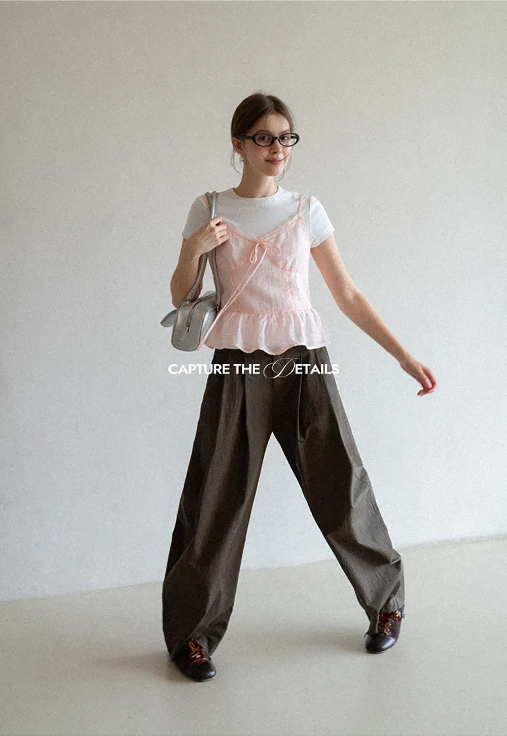 Sheer lace trim camisole with front tie and peplum hem