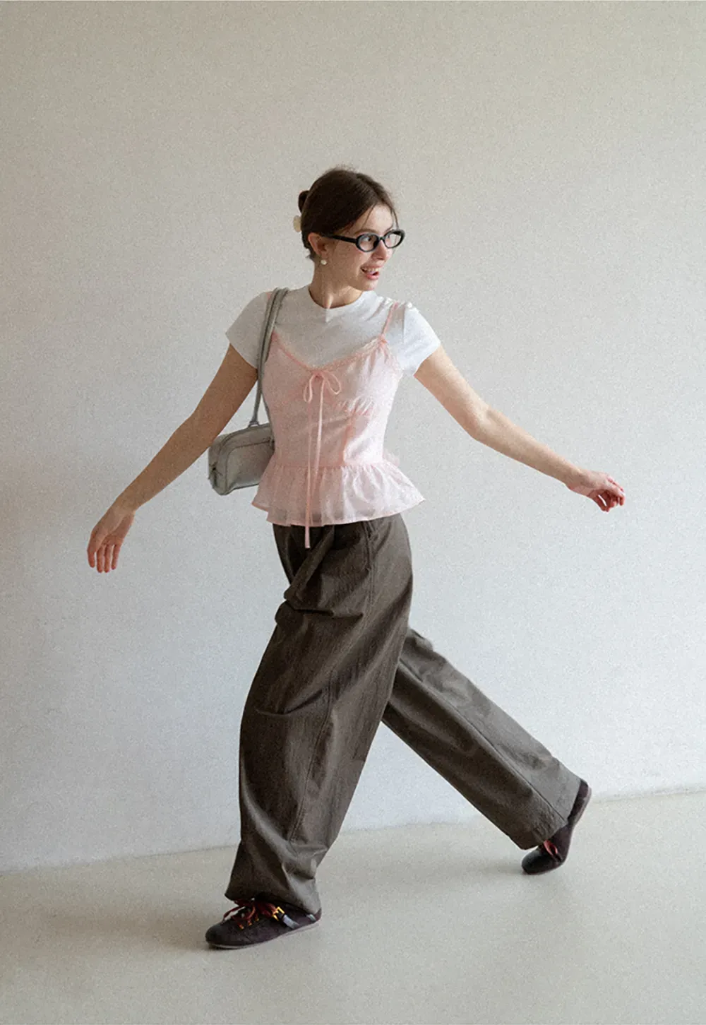 Sheer lace trim camisole with front tie and peplum hem