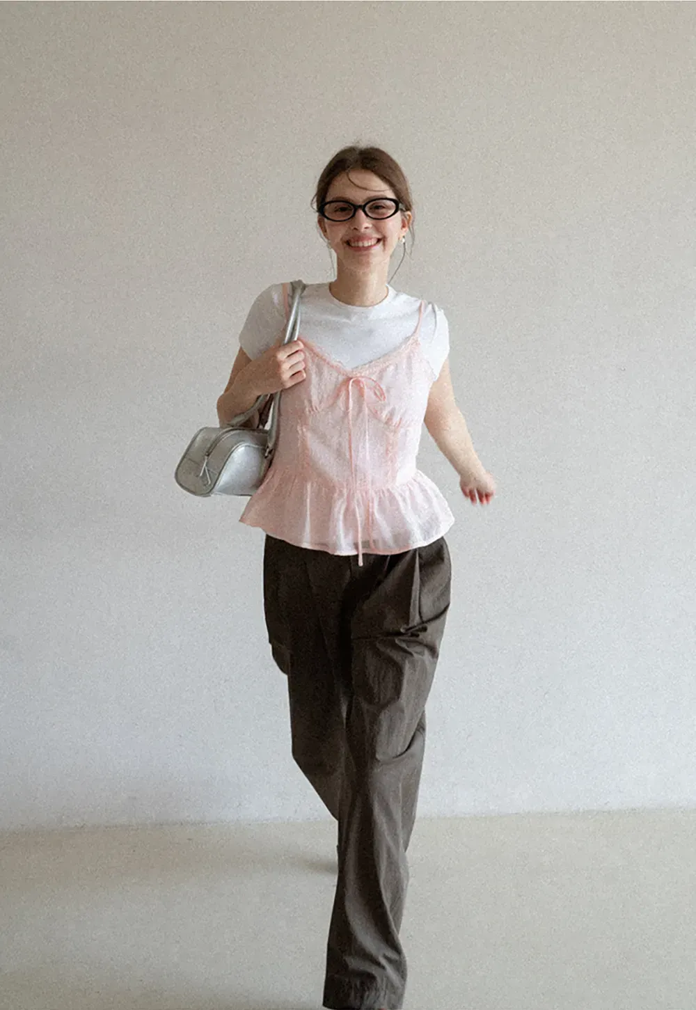 Sheer lace trim camisole with front tie and peplum hem