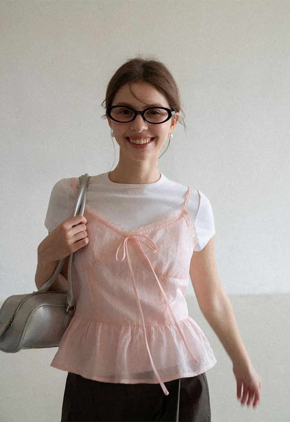 Sheer lace trim camisole with front tie and peplum hem