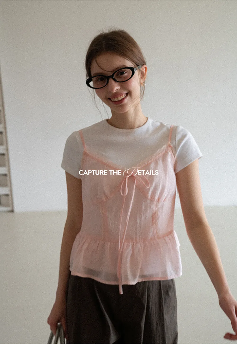 Sheer lace trim camisole with front tie and peplum hem