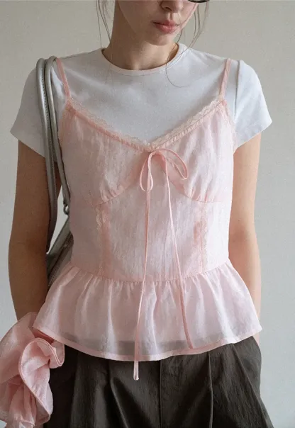 Sheer lace trim camisole with front tie and peplum hem