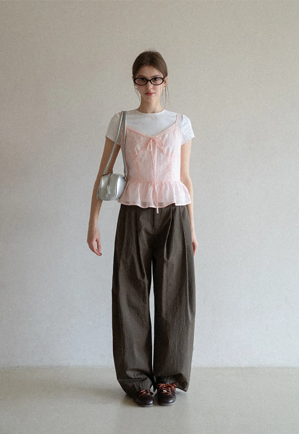 Sheer lace trim camisole with front tie and peplum hem