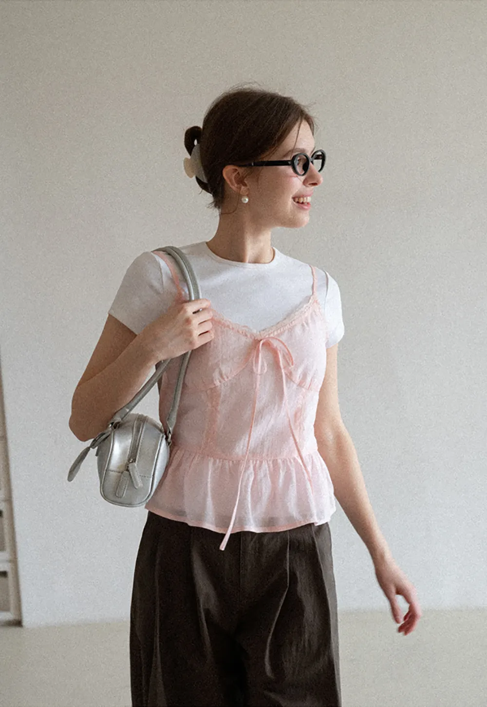 Sheer lace trim camisole with front tie and peplum hem