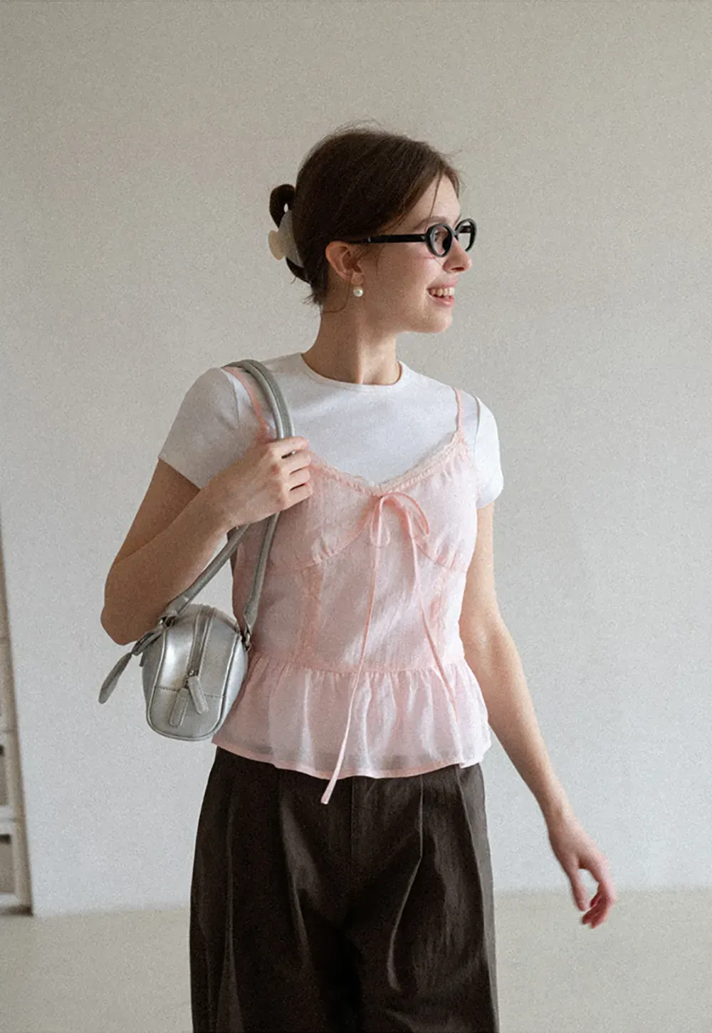 Sheer lace trim camisole with front tie and peplum hem