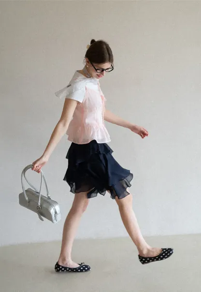 Sheer lace trim camisole with front tie and peplum hem