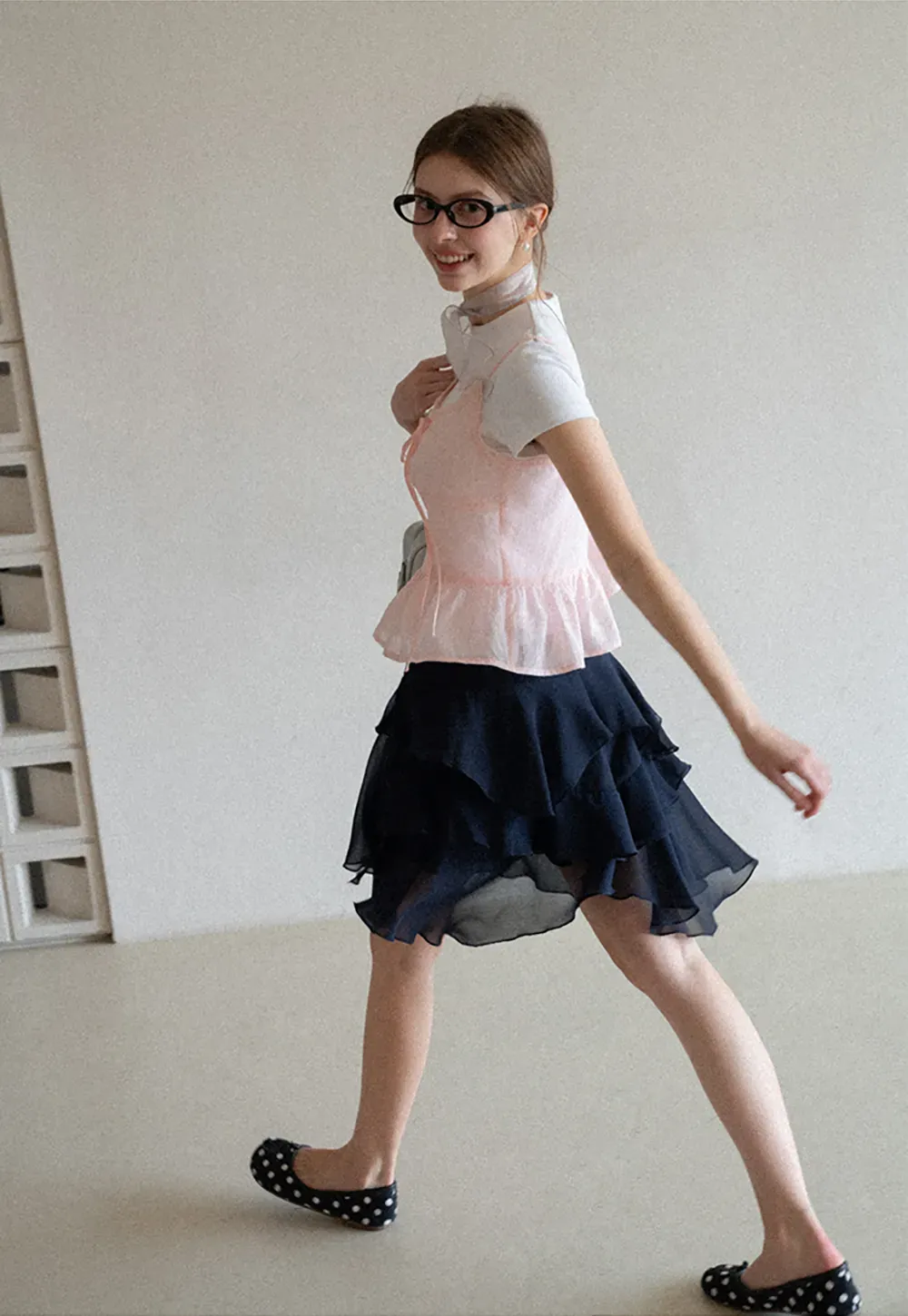 Sheer lace trim camisole with front tie and peplum hem