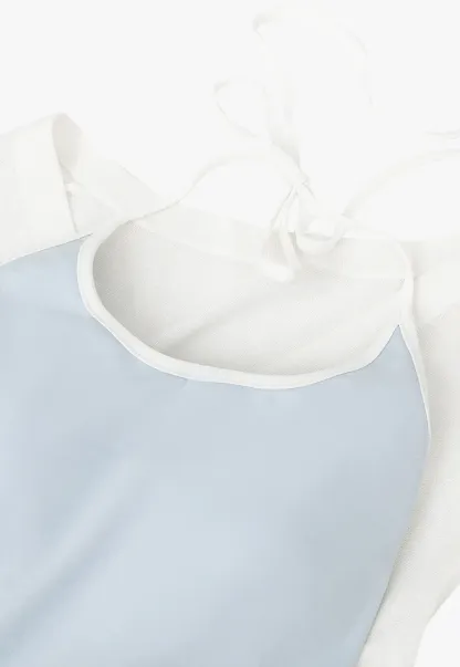 V Neck Sleeveless Knit Top With Ribbed Hem And Cropped Fit