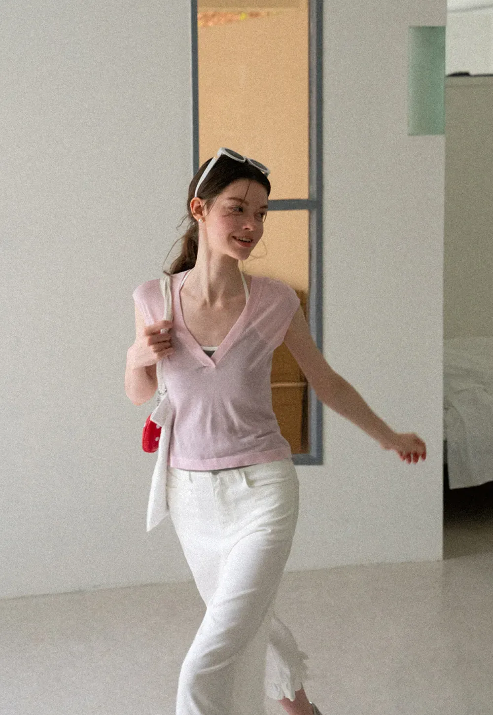 V Neck Sleeveless Knit Top With Ribbed Hem And Cropped Fit
