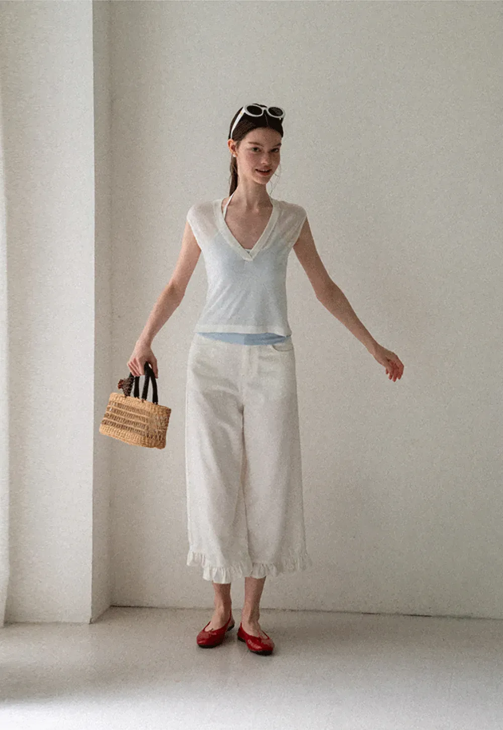 V Neck Sleeveless Knit Top With Ribbed Hem And Cropped Fit