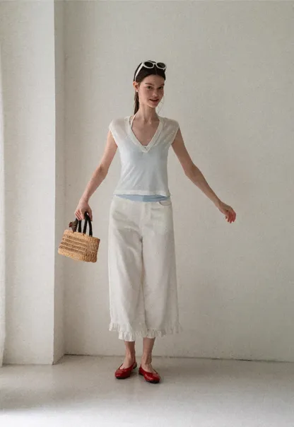 V Neck Sleeveless Knit Top With Ribbed Hem And Cropped Fit