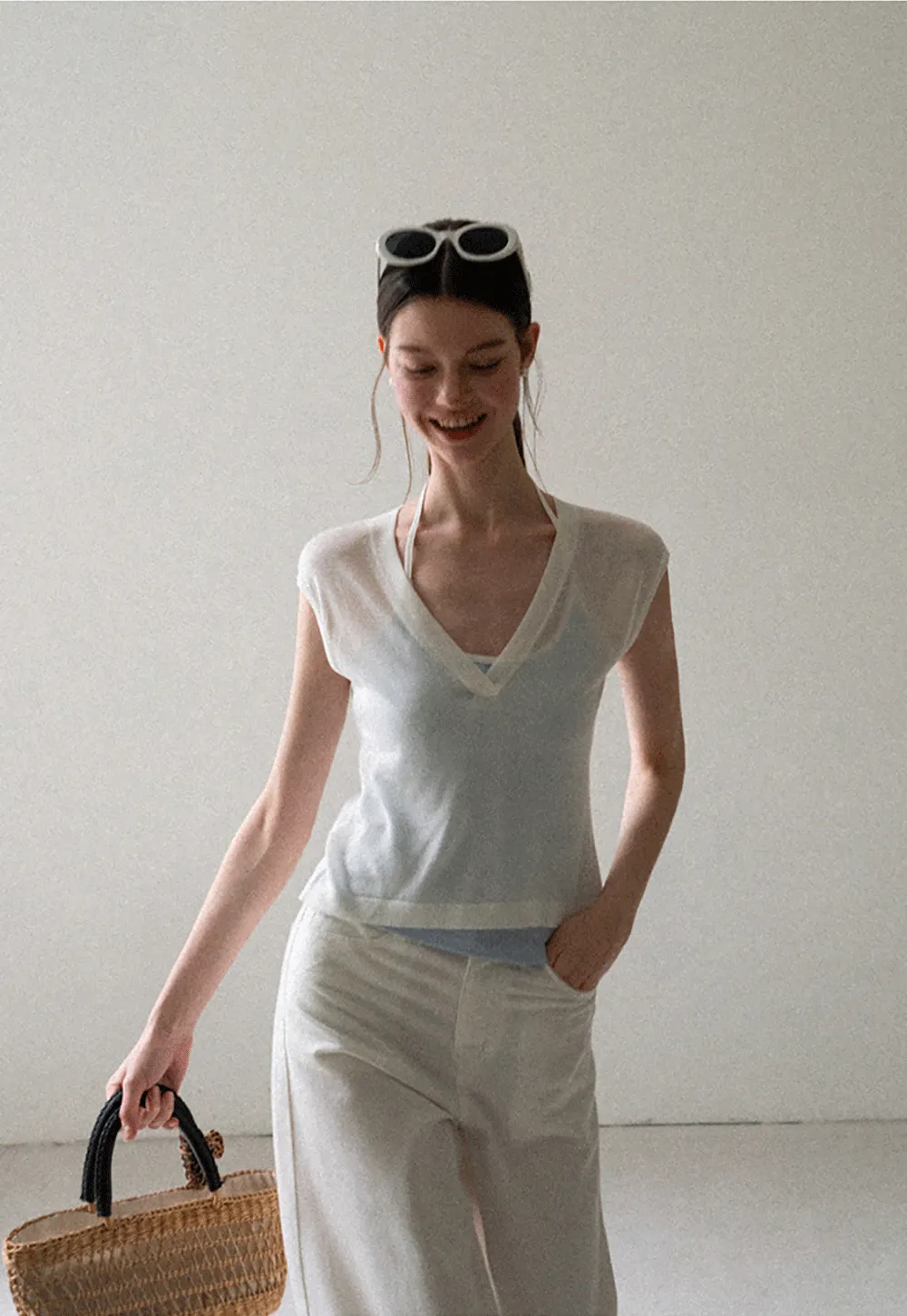 V Neck Sleeveless Knit Top With Ribbed Hem And Cropped Fit