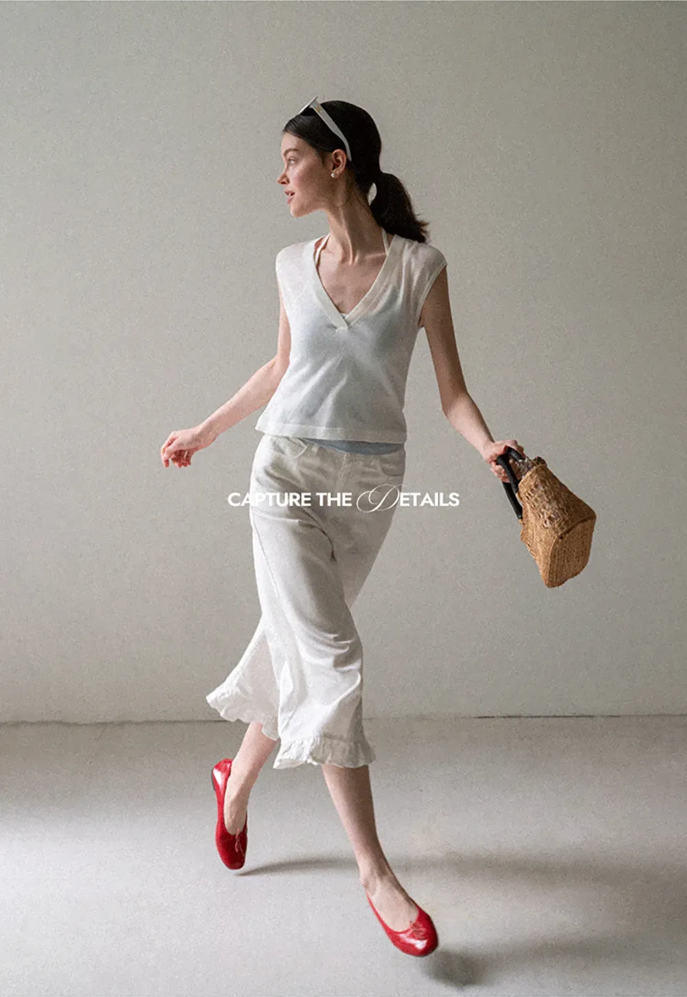 V Neck Sleeveless Knit Top With Ribbed Hem And Cropped Fit
