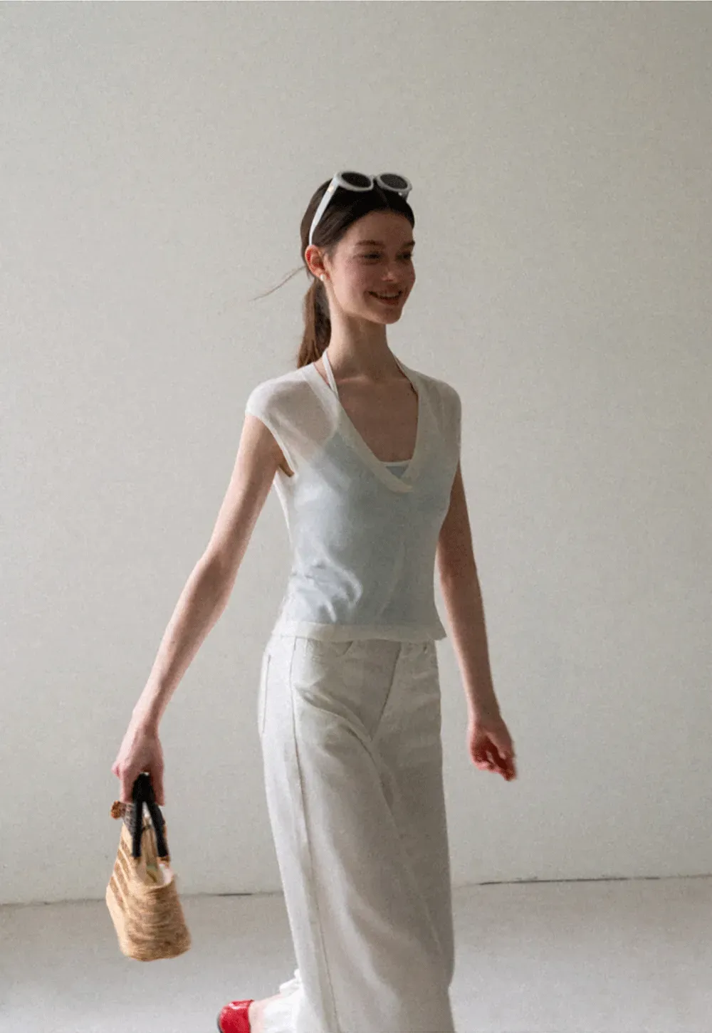 V Neck Sleeveless Knit Top With Ribbed Hem And Cropped Fit
