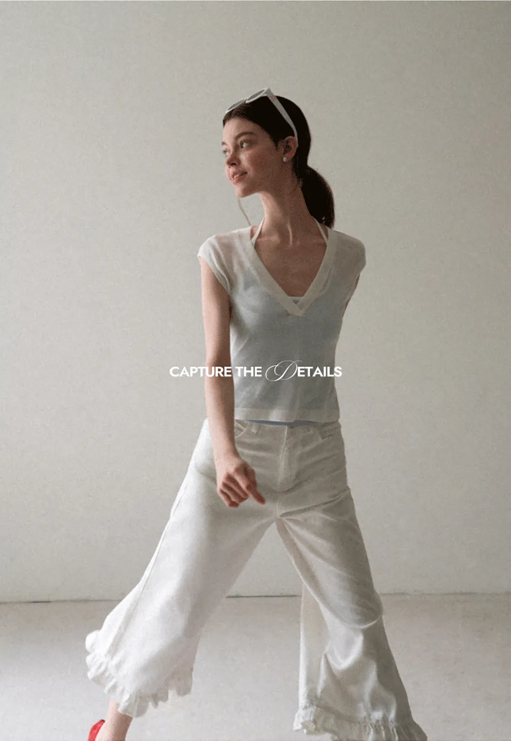 V Neck Sleeveless Knit Top With Ribbed Hem And Cropped Fit
