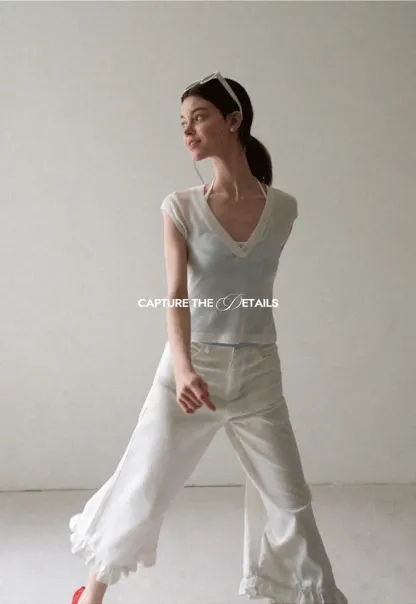V Neck Sleeveless Knit Top With Ribbed Hem And Cropped Fit