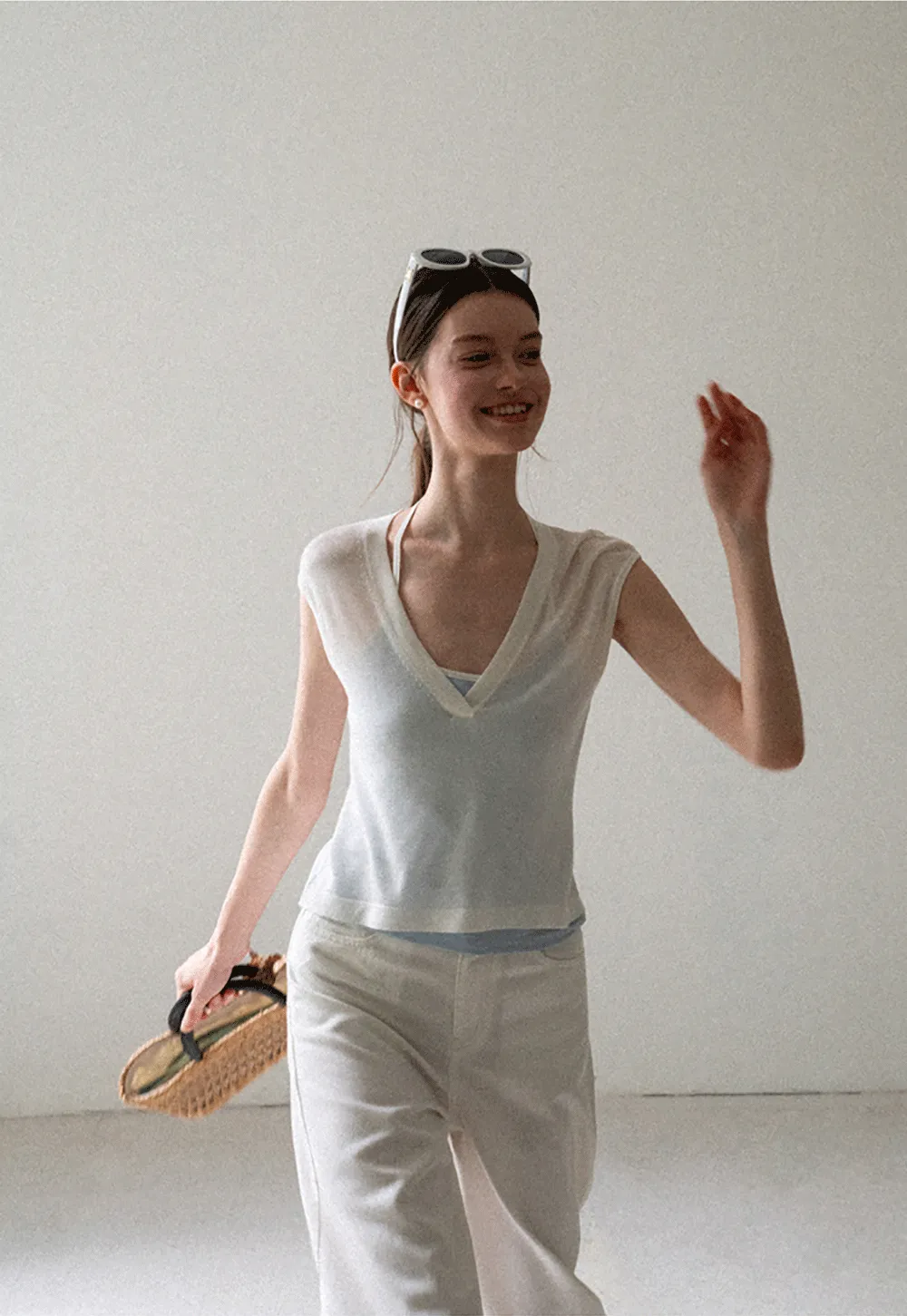 V Neck Sleeveless Knit Top With Ribbed Hem And Cropped Fit