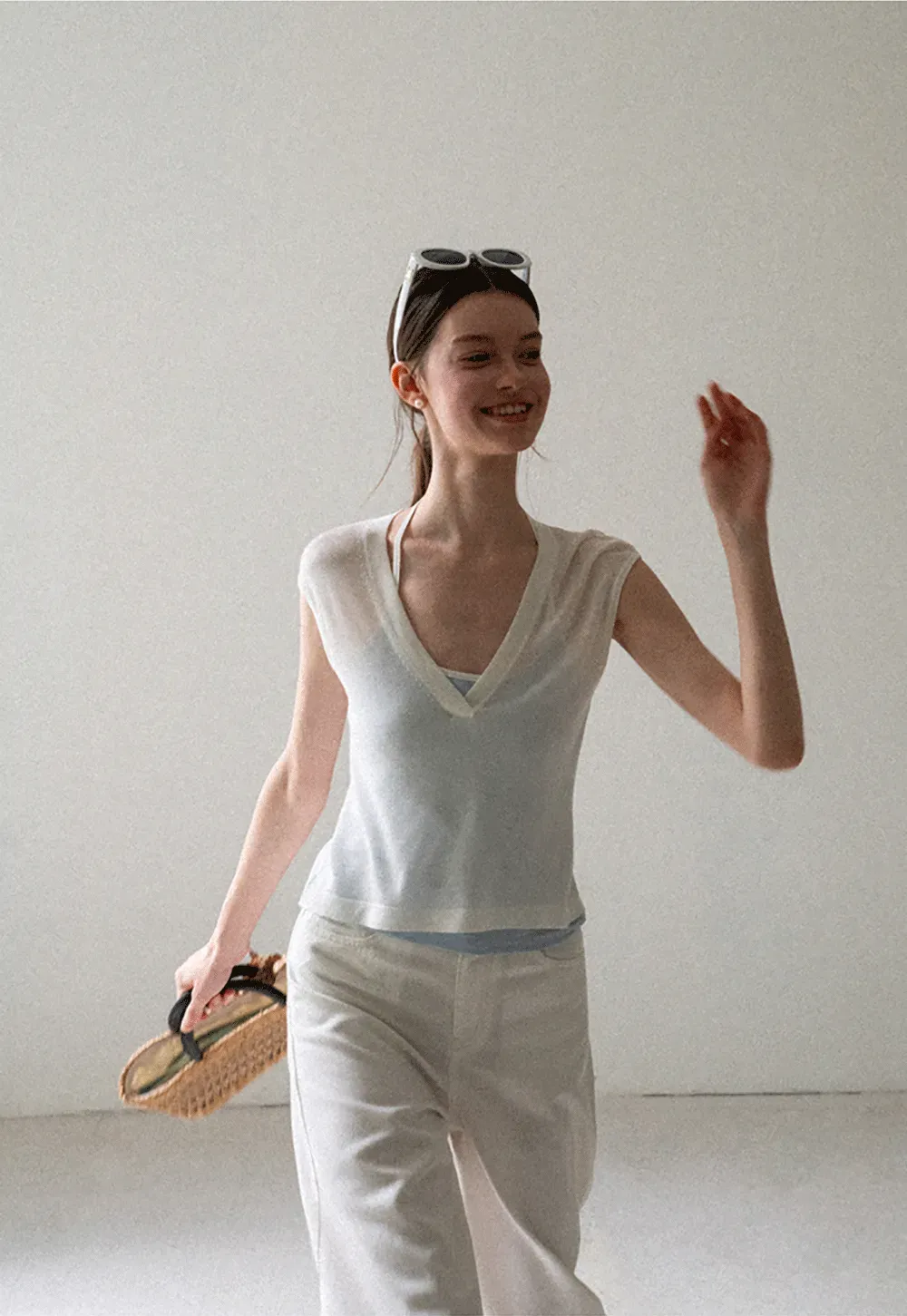 V Neck Sleeveless Knit Top With Ribbed Hem And Cropped Fit