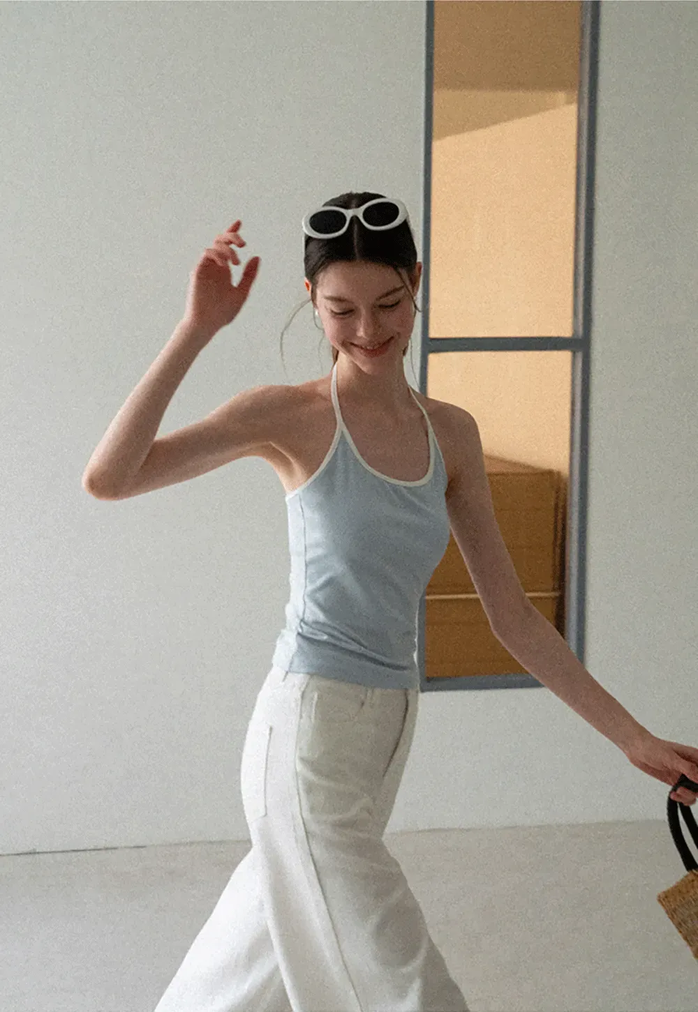 V Neck Sleeveless Knit Top With Ribbed Hem And Cropped Fit