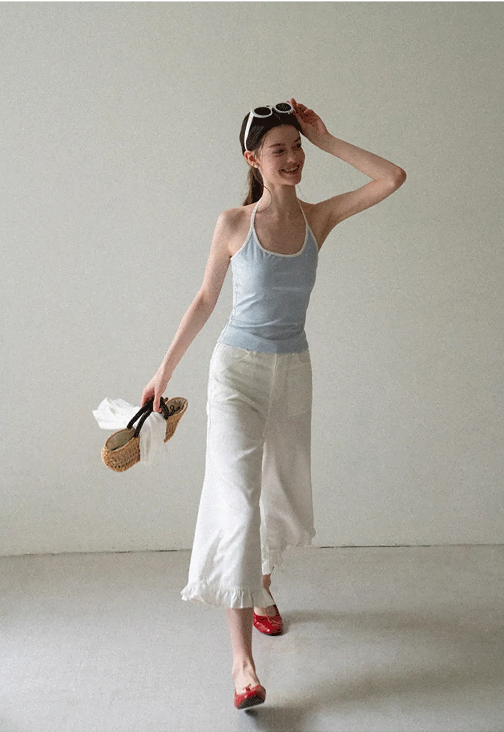 V Neck Sleeveless Knit Top With Ribbed Hem And Cropped Fit