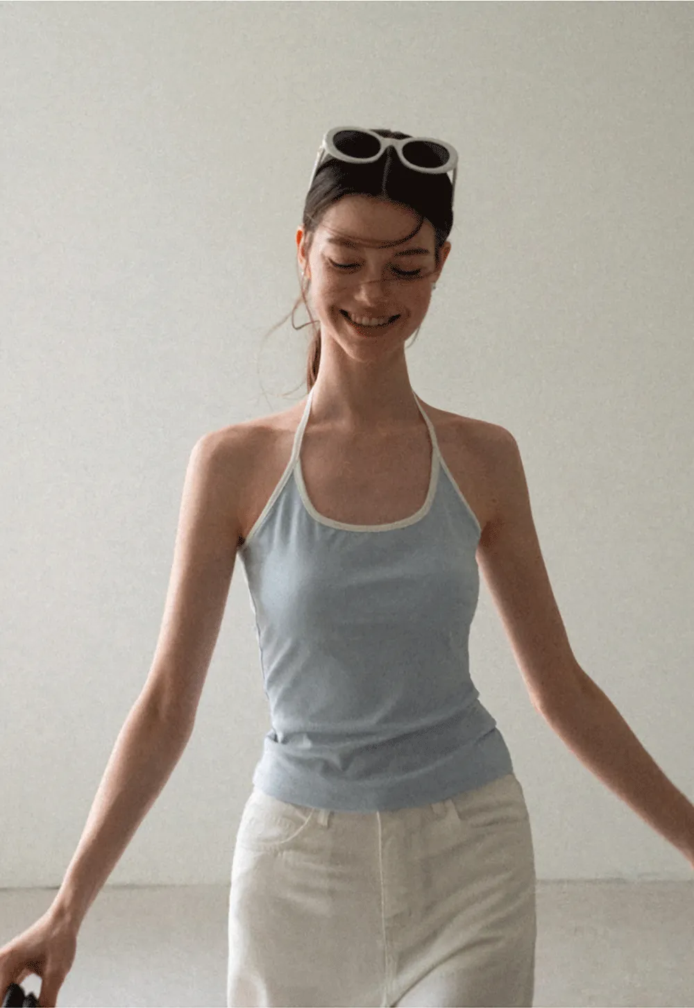 V Neck Sleeveless Knit Top With Ribbed Hem And Cropped Fit