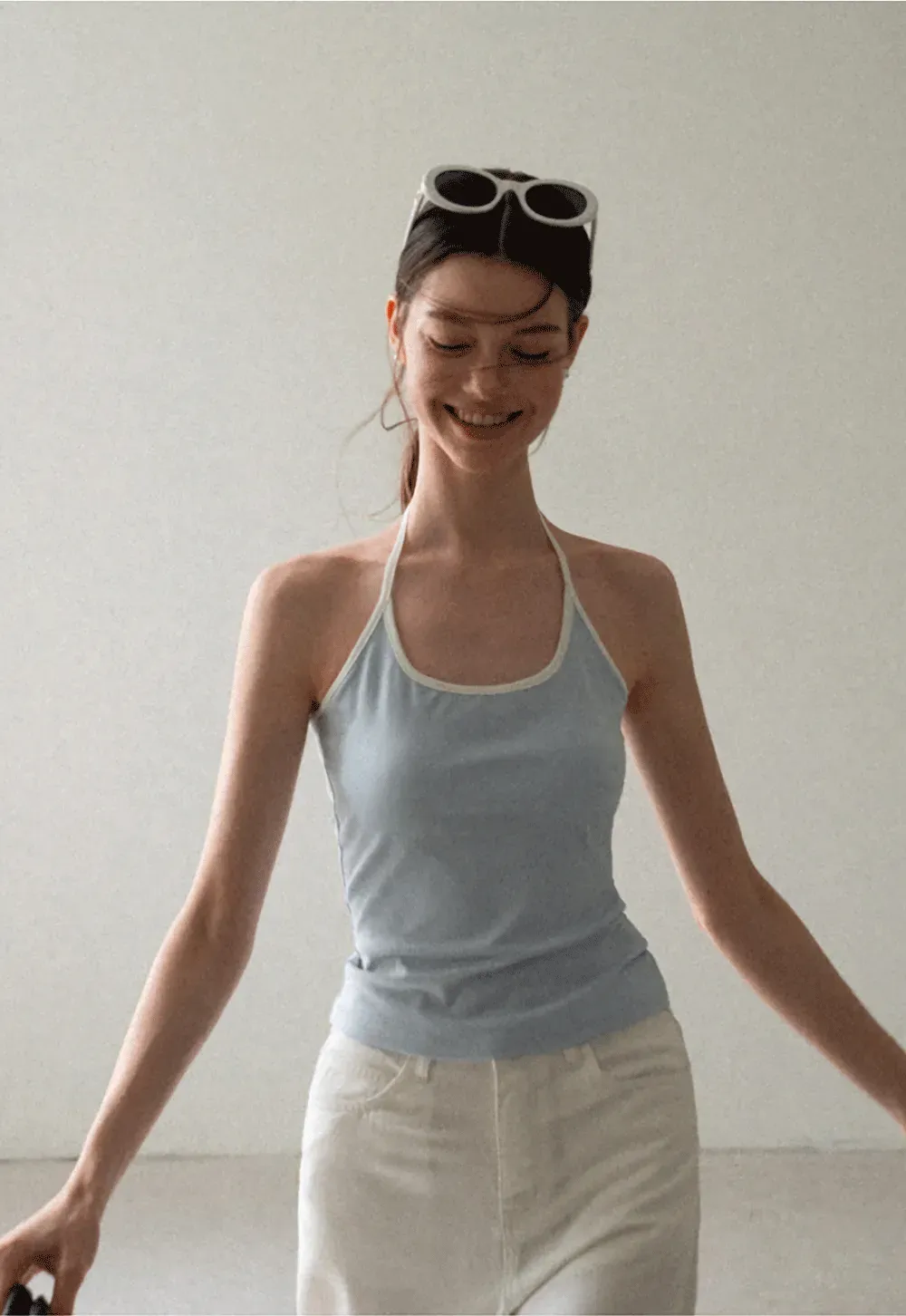 V Neck Sleeveless Knit Top With Ribbed Hem And Cropped Fit