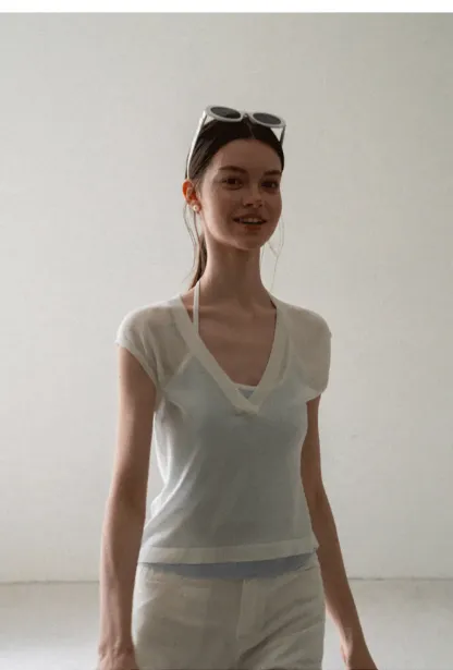 V Neck Sleeveless Knit Top With Ribbed Hem And Cropped Fit
