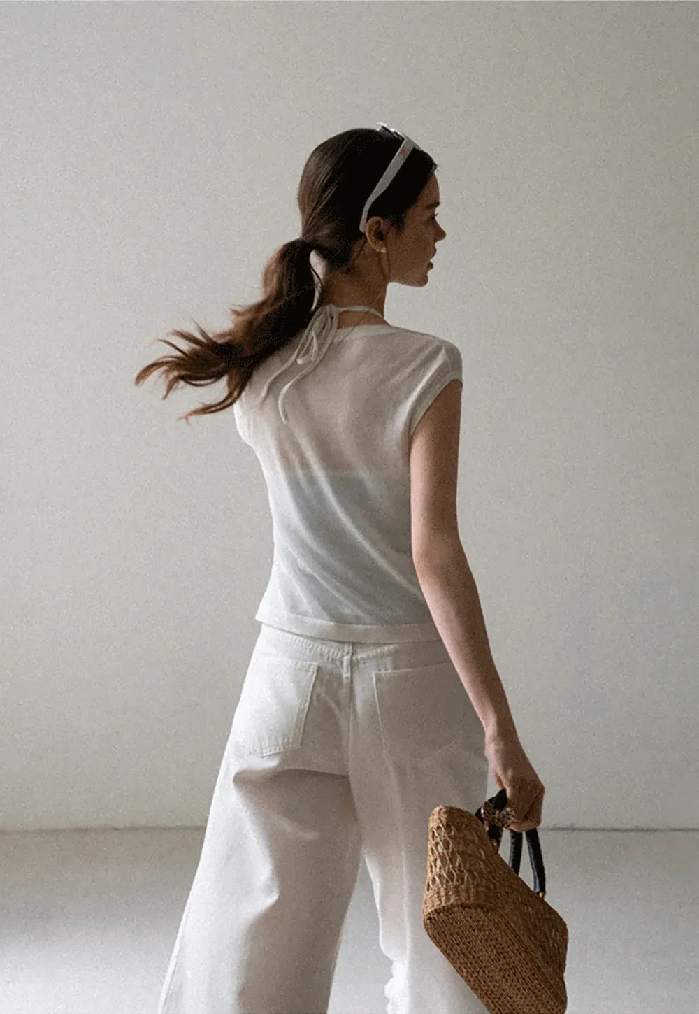 V Neck Sleeveless Knit Top With Ribbed Hem And Cropped Fit