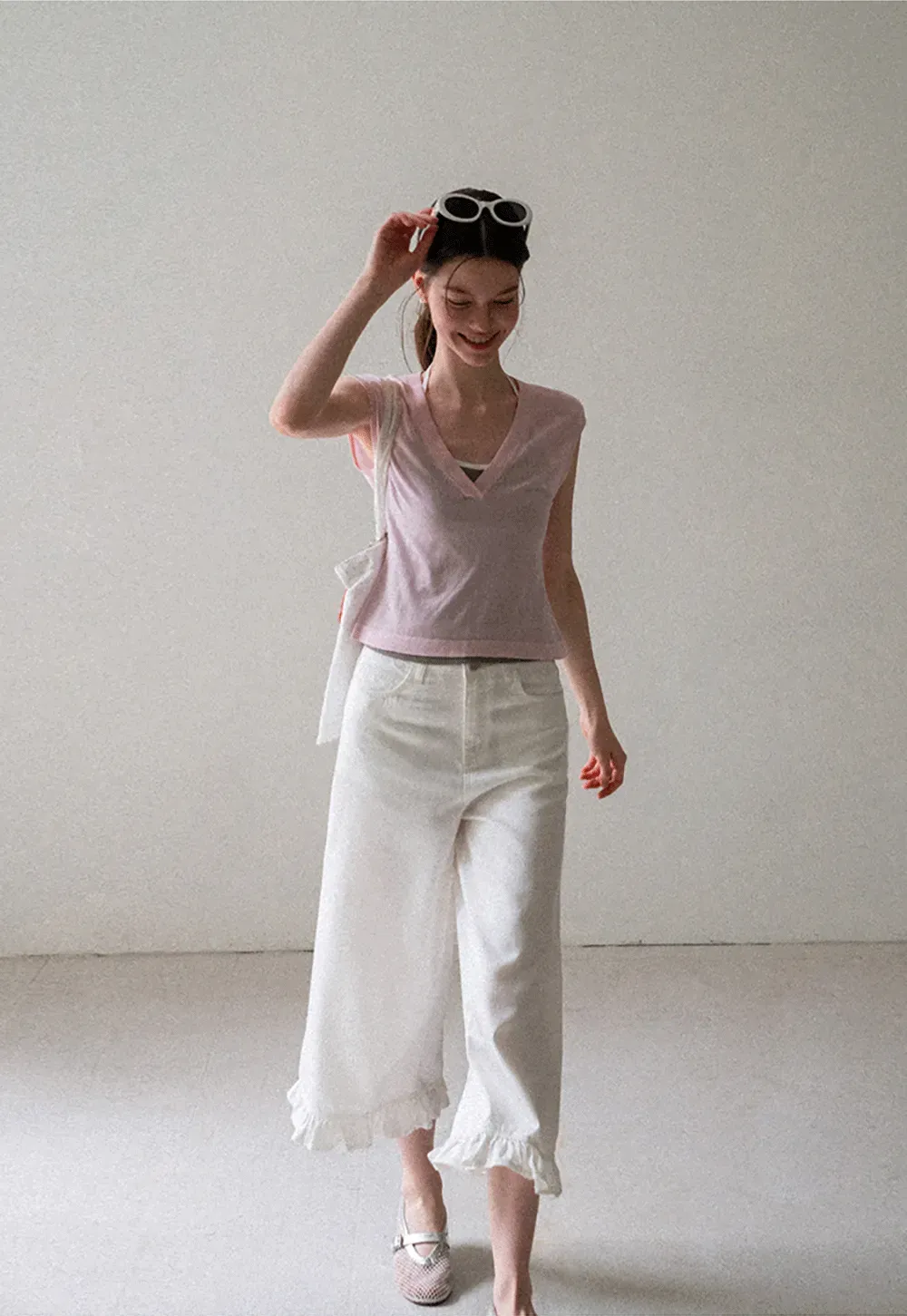 V Neck Sleeveless Knit Top With Ribbed Hem And Cropped Fit