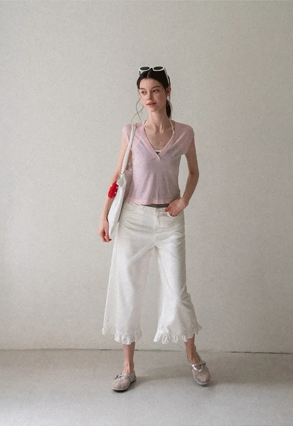 V Neck Sleeveless Knit Top With Ribbed Hem And Cropped Fit