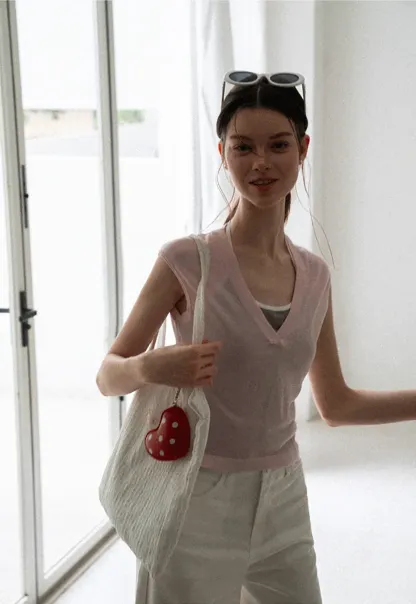 V Neck Sleeveless Knit Top With Ribbed Hem And Cropped Fit