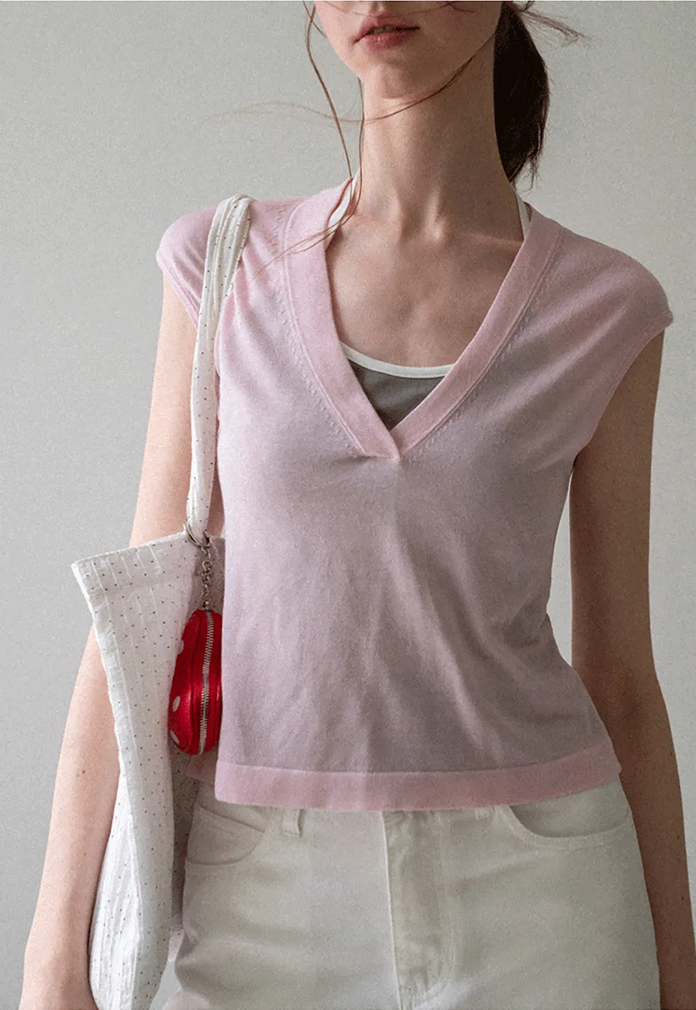 V Neck Sleeveless Knit Top With Ribbed Hem And Cropped Fit