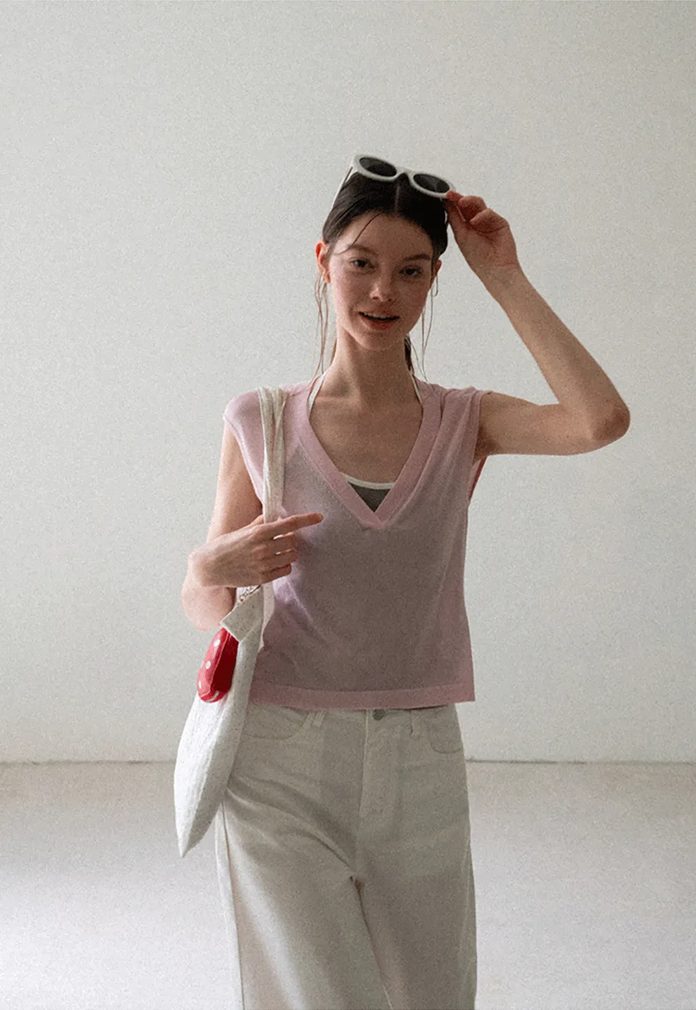 V Neck Sleeveless Knit Top With Ribbed Hem And Cropped Fit