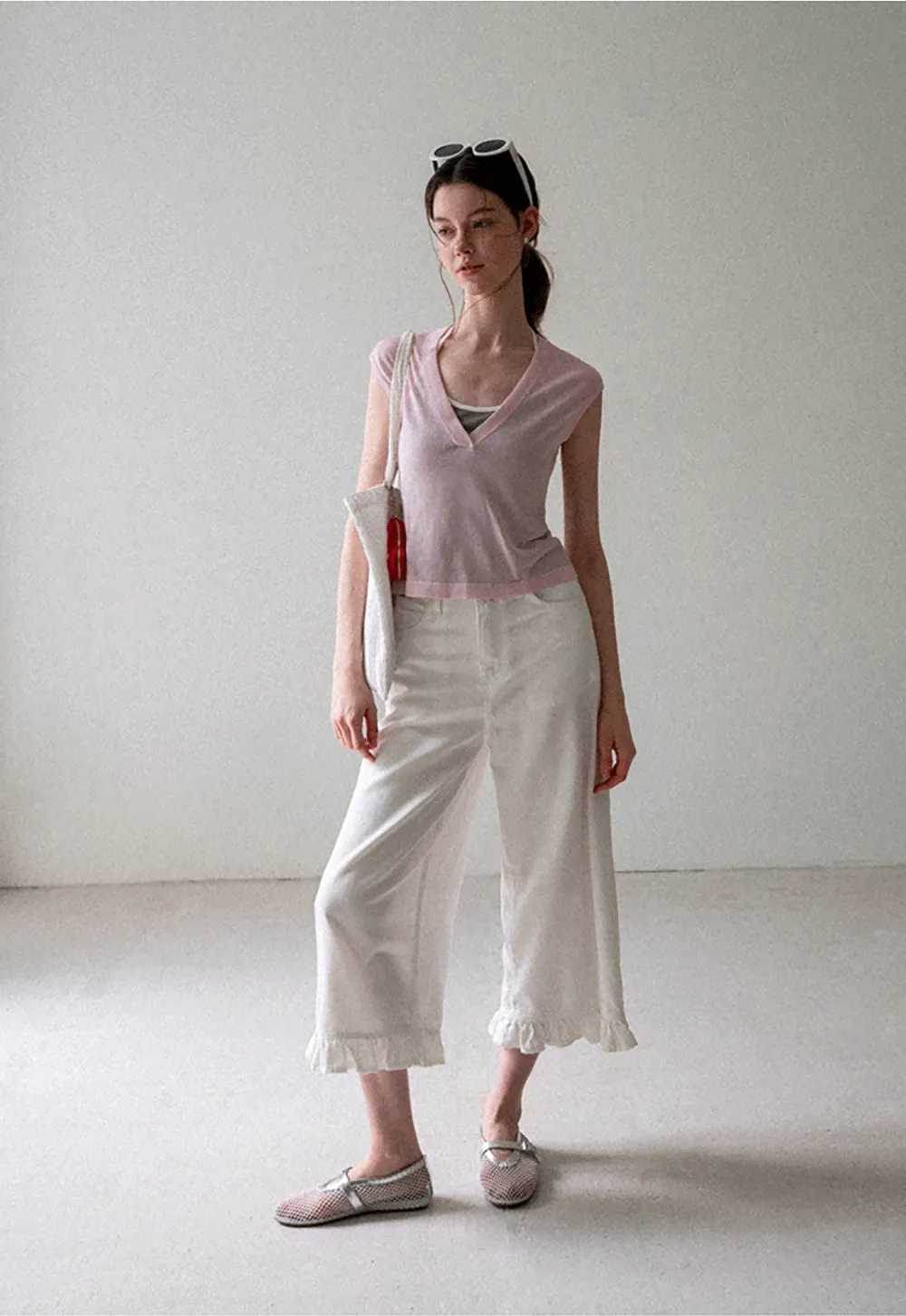 V Neck Sleeveless Knit Top With Ribbed Hem And Cropped Fit