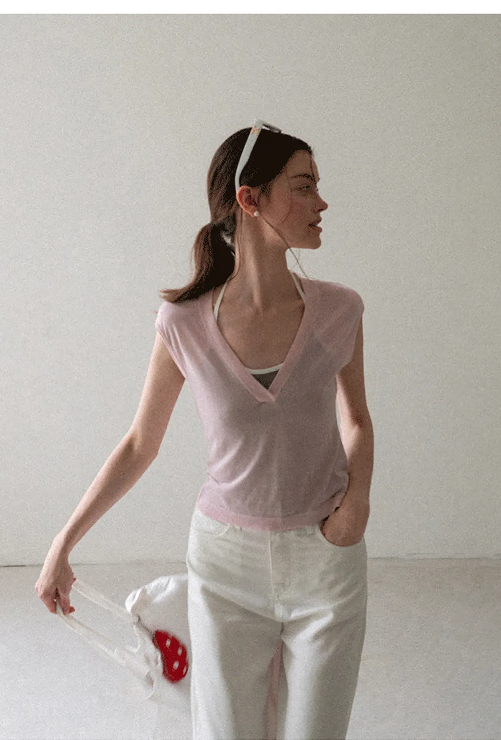 V Neck Sleeveless Knit Top With Ribbed Hem And Cropped Fit