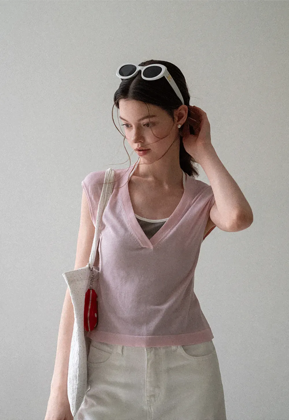 V Neck Sleeveless Knit Top With Ribbed Hem And Cropped Fit