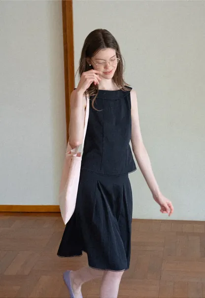 Peplum Hem Sleeveless Top and Pleated Skirt