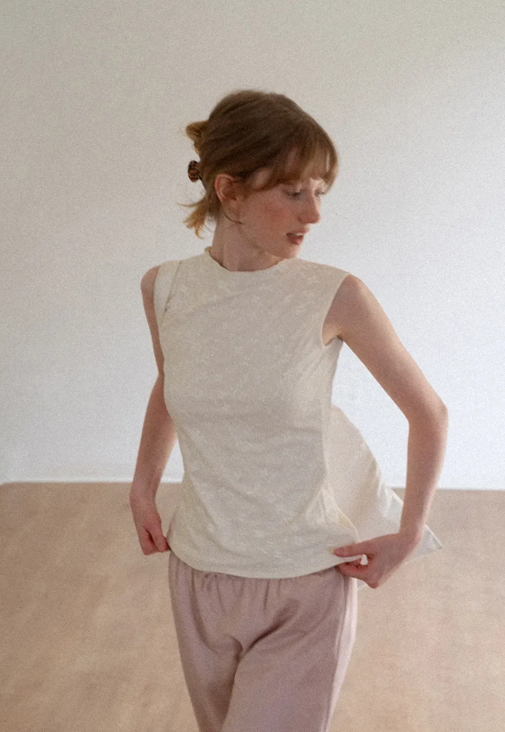 Textured Sleeveless Top with Asymmetrical Hem