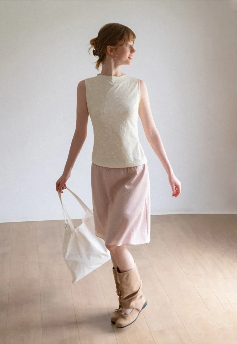 Textured Sleeveless Top with Asymmetrical Hem