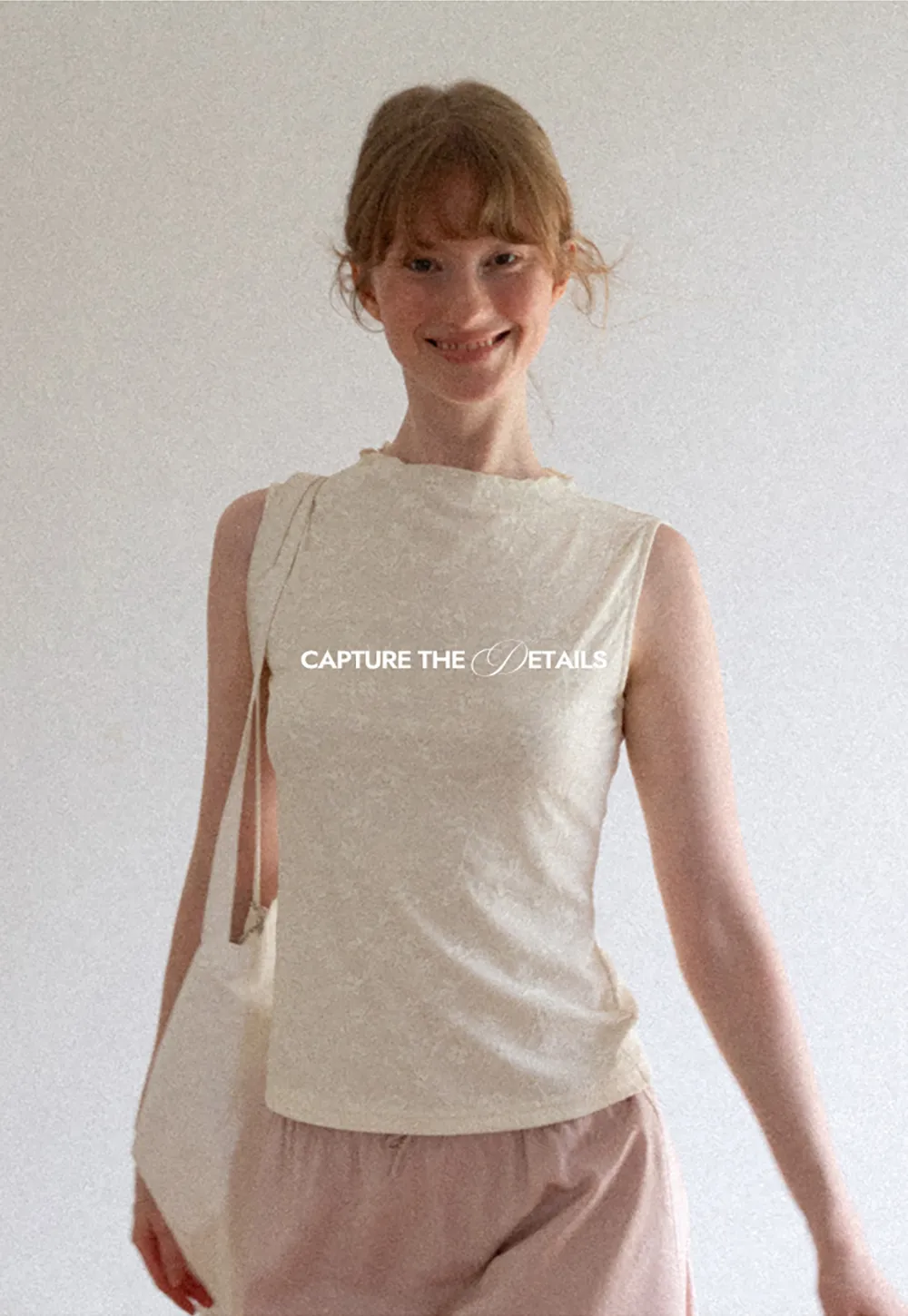 Textured Sleeveless Top with Asymmetrical Hem