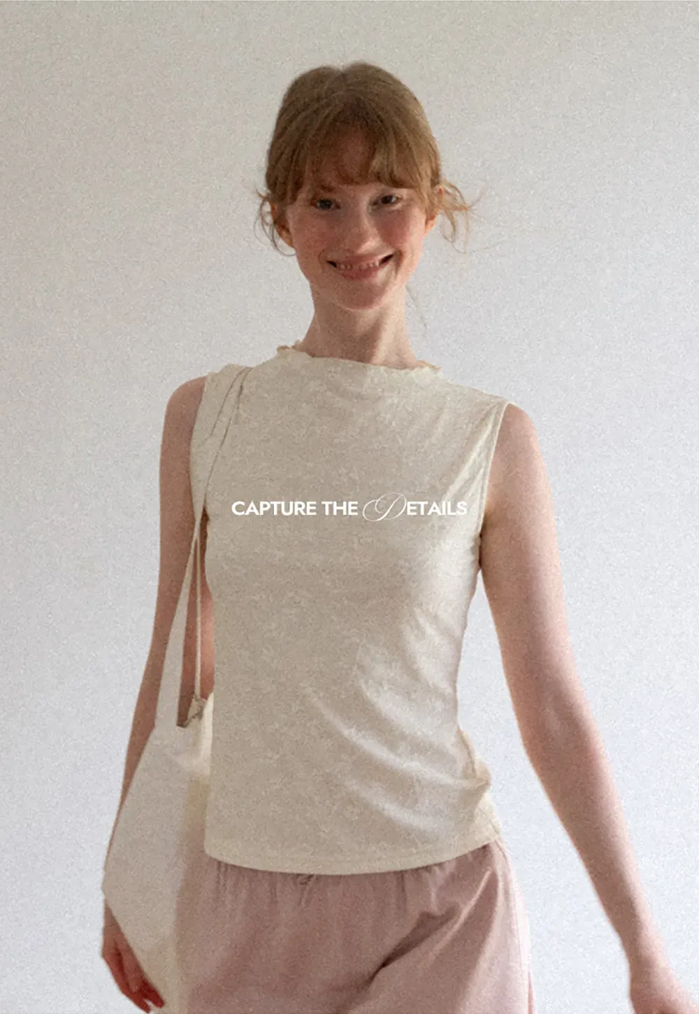 Textured Sleeveless Top with Asymmetrical Hem